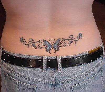 Tattoo of angel wings on middle of upper back.