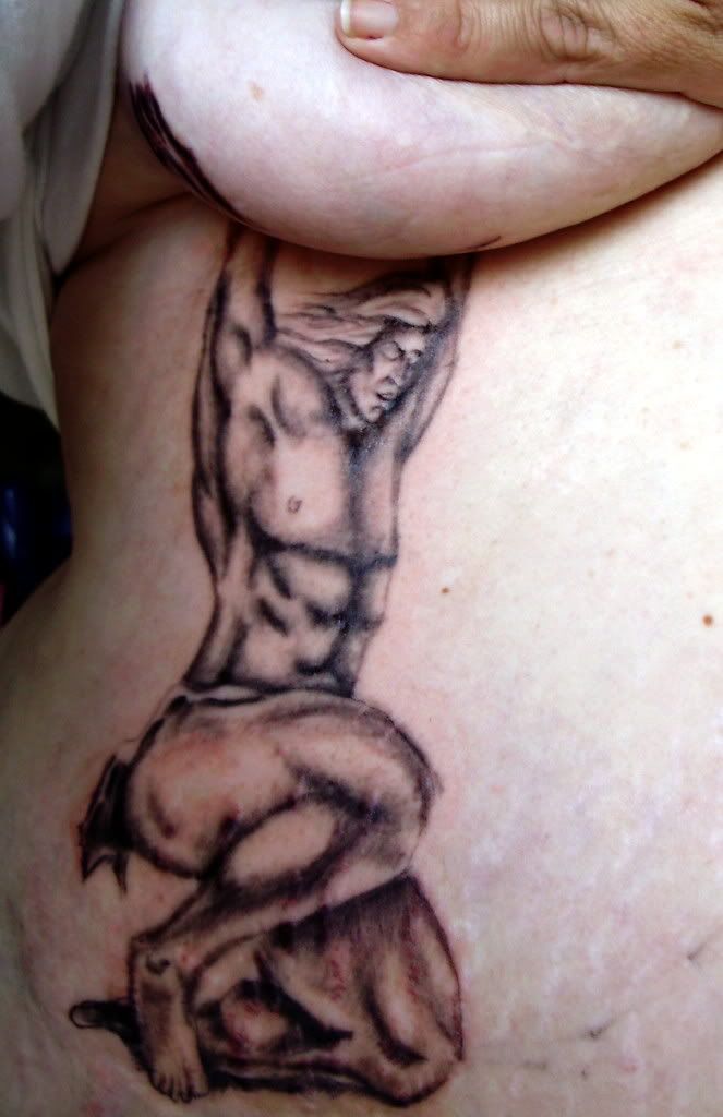 Tagged as: atlas tattoo, bad tattoos, boob tats, crazy tats, nipple tattoos,